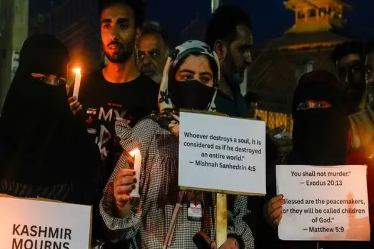 People hold a candlelight vigil to pay tribute to the victims of the Pahalgam terror attack, outside Jamia Masjid Nowhatta in downtown Srinagar on Wednesday. 