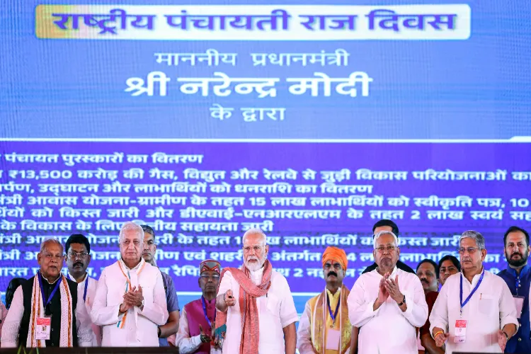 Bihar CM Nitish Kumar with PM Narendra Modi and others while inauguration and foundation stone laying for several infrastructure and welfare projects during a public meeting on National Panchayati Raj Day in Madhubani on Thursday.