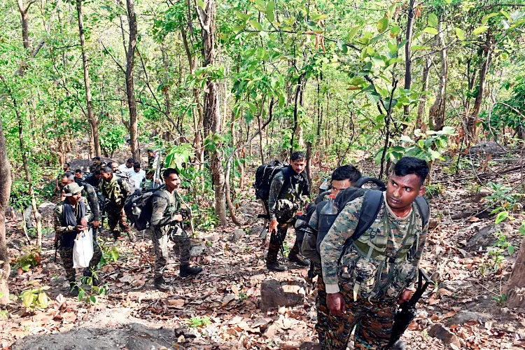 CRPF personnel conduct a search operation during an encounter with Naxalites at Lugu hills, in Bokaro on Monday. Reportedly, 8 Naxals killed in the encounter.