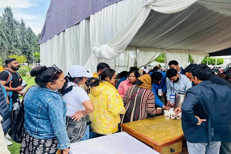 Passengers being offered refreshments as they wait at Srinagar International Airport, in Srinagar on Wednesday.