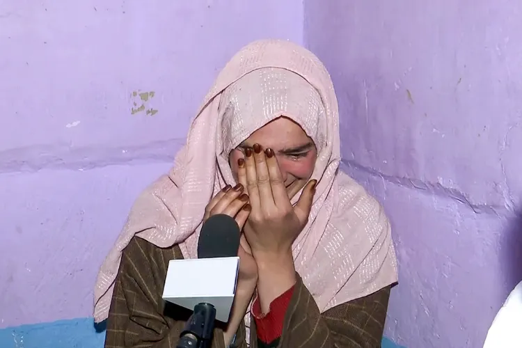 Sister of local Syed Adil Hussain Shah, who died in the Pahalgam Terror attack gets emotional while speaking with media about his brother, in Anantnag on Thursday.