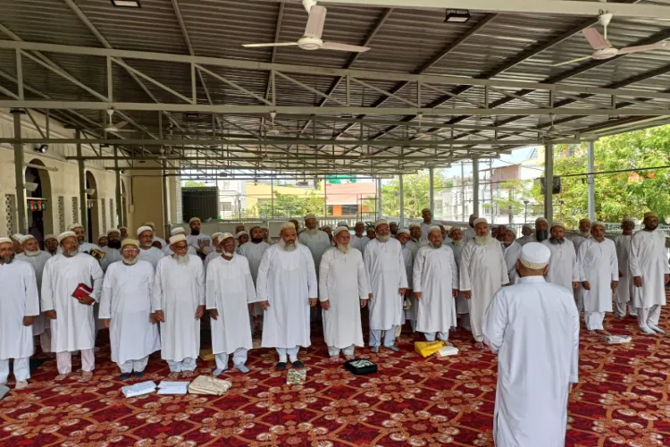 Members of the Dawoodi Bohra community observing a moment of silence.