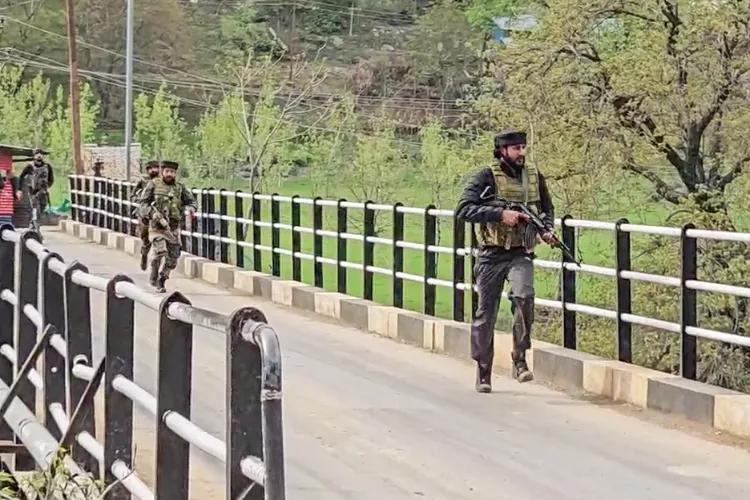 Security personnel rush to the spot following a terrorist attack on tourists, in Pahalgam on Tuesday. 