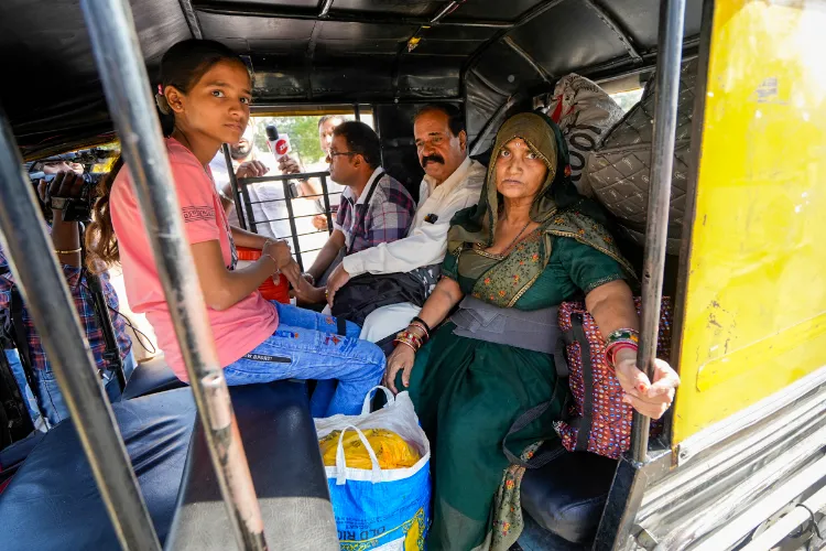 Pakistani nationals arrive at the Integrated Check Post at the Attari-Wagah border to move to their country, near Amritsar, Saturday, April 26, 2025.