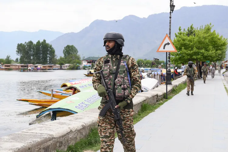 CRPF personnel patrol on the banks of Dal lake after the Pahalgam terror attack that took place on April 22, in Srinagar on Saturday.