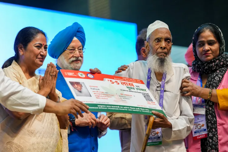 Delhi CM Rekha Gupta during the distribution of Ayushman Bharat cards to eligible senior citizens, aged 70 years and above, under the Pradhan Mantri Vaya Vandana Yojana at the Thyagaraj Stadium in New Delhi on April 28, 2025. 