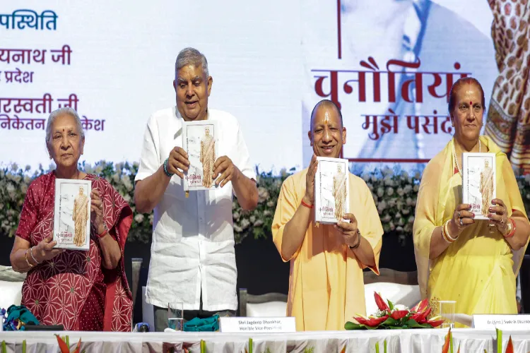 Vice President Jagdeep Dhankhar, his wife Sudesh Dhankhar and UP CM Yogi Adityanath release the book 'Chaunautiyan Mujhe Pasand Hain'