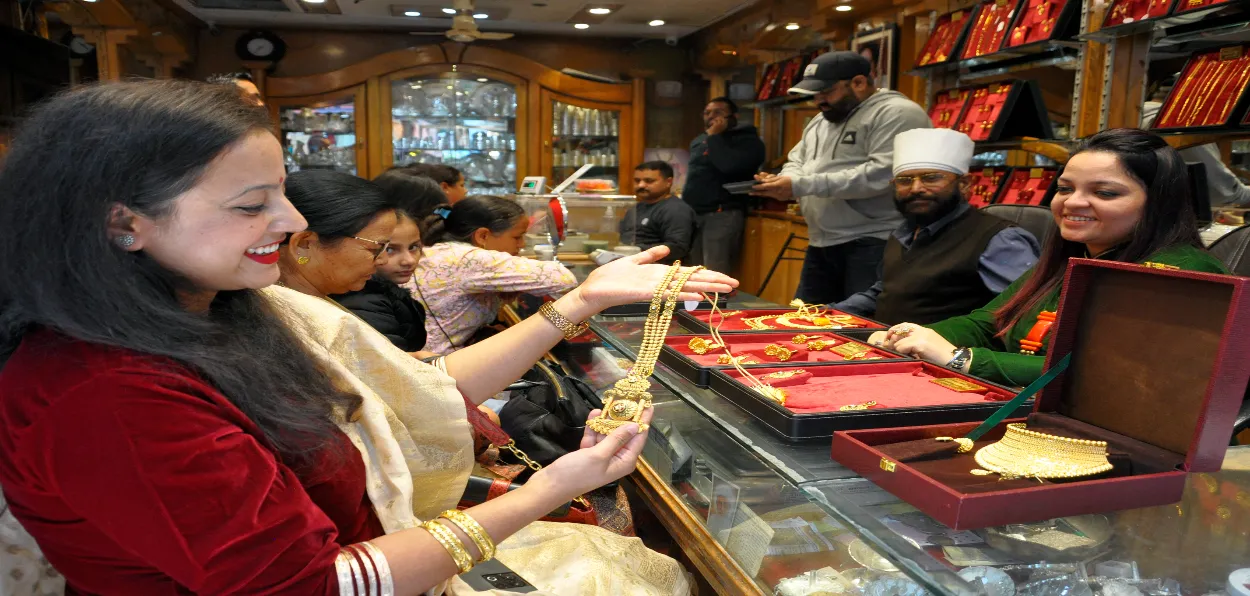 A woman buying gold on the occasion of Dhanteras festival in Kullu, HImachal Pradesh