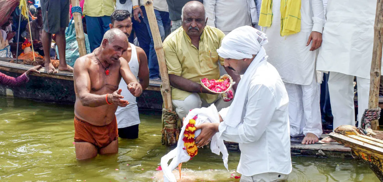 Family members of Shubham Dwivedi, one of the victims of the Pahalgam terror attack immerse his ashes, at Sangam in Prayagraj