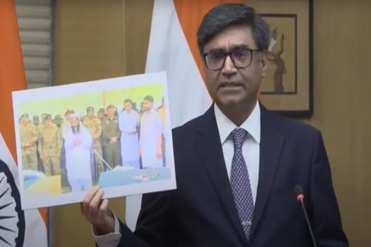 Foreign Secretary Vikram Misri showing the picture of LeT terrorist Hafiz Abdul Rauf's funeral