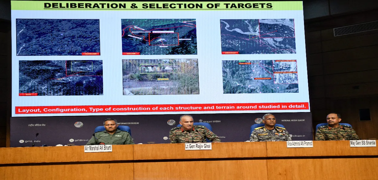 DGMO Lt Gen Raji Ghai, Air Marshal A K Bharti, and Vice Admiral AN Pramod  at a press briefing where images of damaged Pakistan airbases are being shown on screen in the background