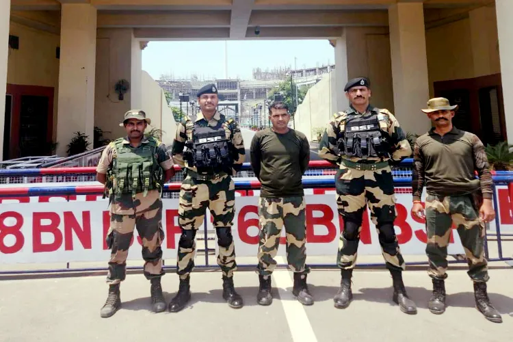 BSF constable  Purnam Kumar Shaw (in the center) with other BSF personnel after entering India