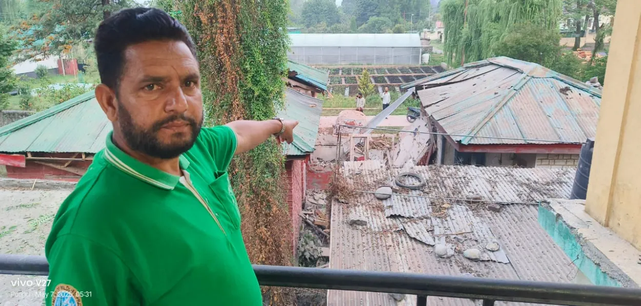 A resident of Poonch town in J&K shows damaged houses which were targeted by Pakistan Army