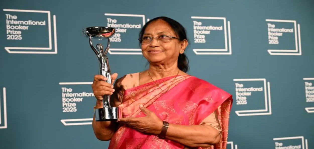 Banu Mushtaq holding Booker Prize for her book Heart Lamp