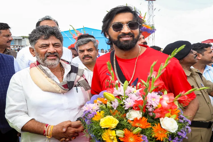 Karnataka Deputy Chief Minister DK Shivakumar receives Royal Challengers Bengaluru's Krunal Pandya
