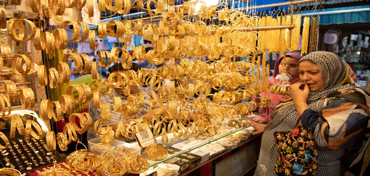 A Kashmiri woman looking at the wares  at a artificial jewellery shop in Srinagar (Pics by Basit Zargar)