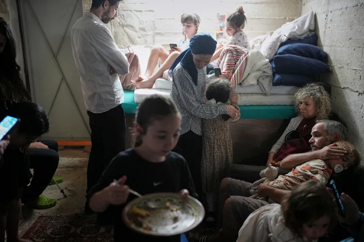 Israelis in a shelter as Iran hit civilians areas with missiles