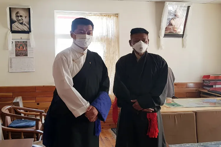Newly elected Sikyong Penpa Tsering and former Sikyong Lobsang Sangay 