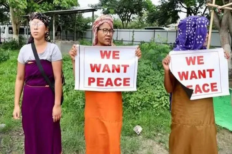 Manipuri protestors holding up slogans for peace