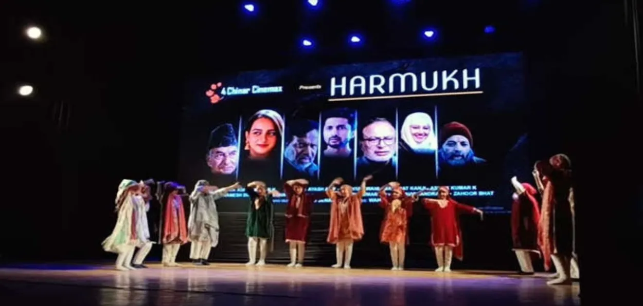 Local artists displaying poster of Harmukh at the launch in Srinagar