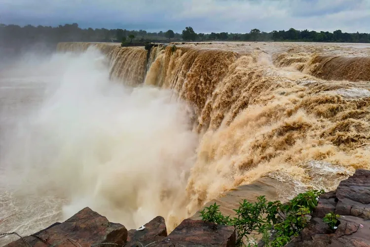 The Indravati river flows in spate after rainfall at Chitrakote waterfall, in Bastar district