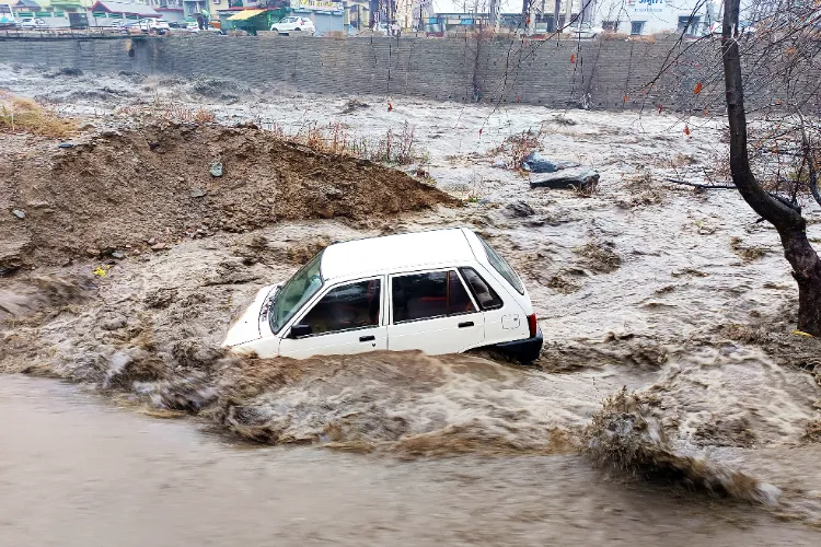 A car swept away by flash floods in Kullu, Himachal Pradesh