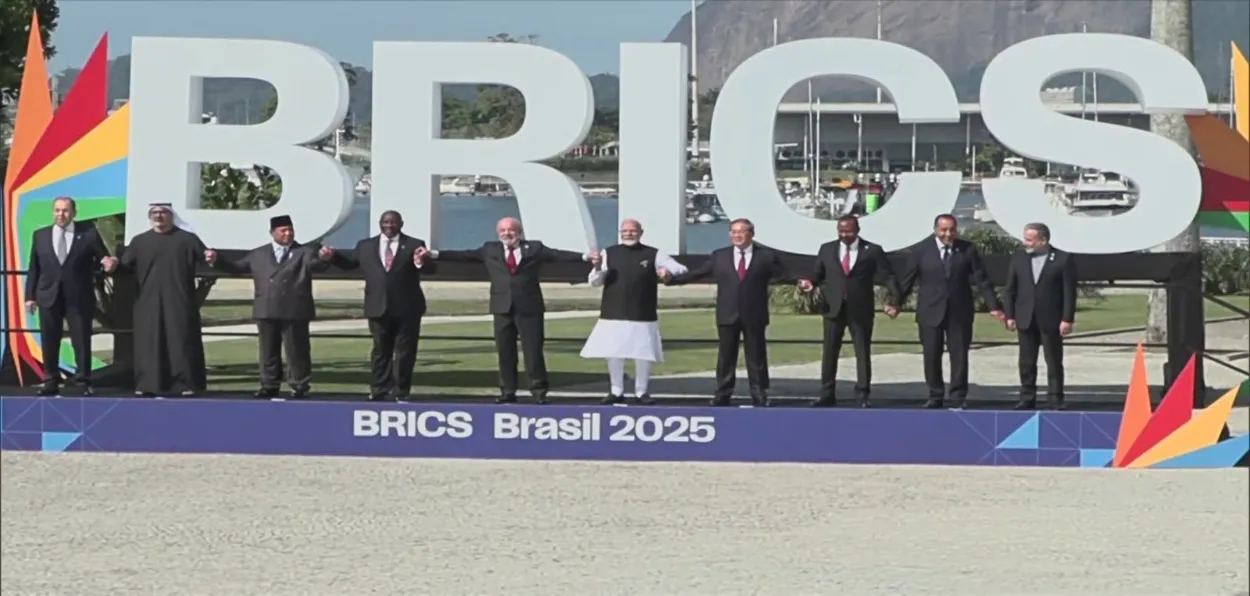 leading holding hands at the BRICs Summit in Rid de Janeiro 
