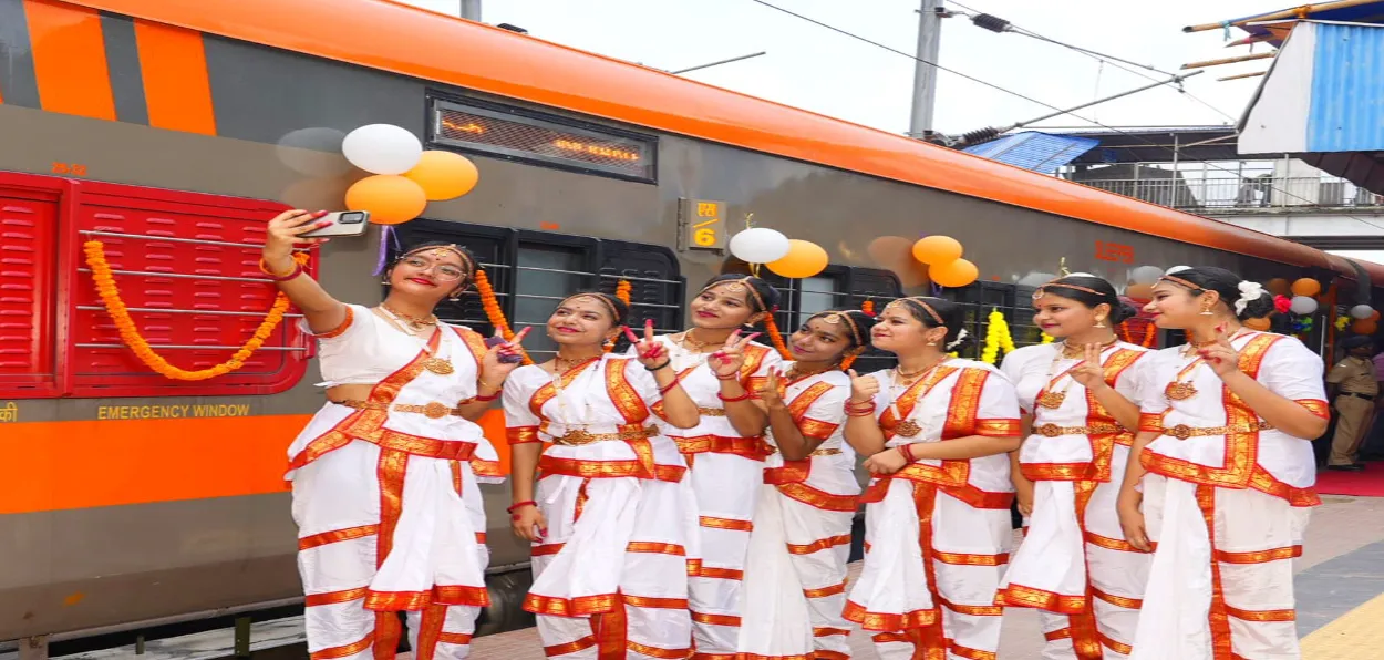 Young school girls taking a selfie in front of the just inaugurated Amrit Bharat service at Patna Railway station