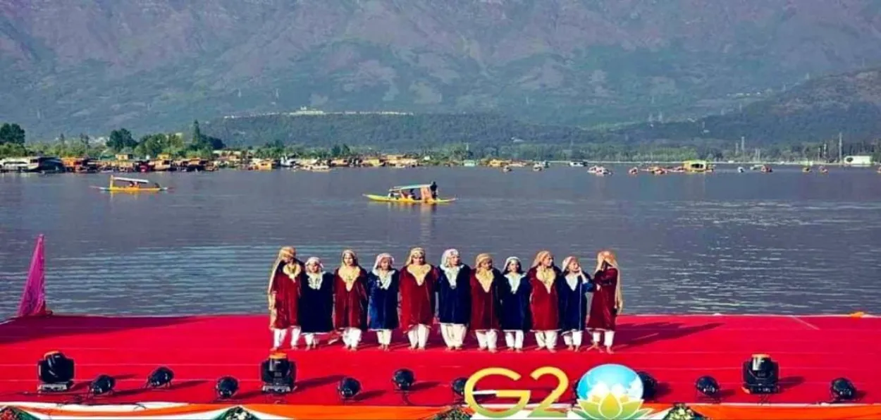 Women artists rehearsing Rouf, traditional Kashmiri dance on the banks of Dal Lake for G-20