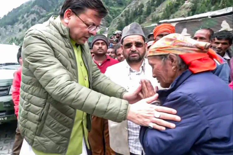 Uttarakhand Chief Minister Pushkar Singh Dhami interacts with the cloudburst-affected families during his visit to Dharali to assess the damage caused by the disaster (file)