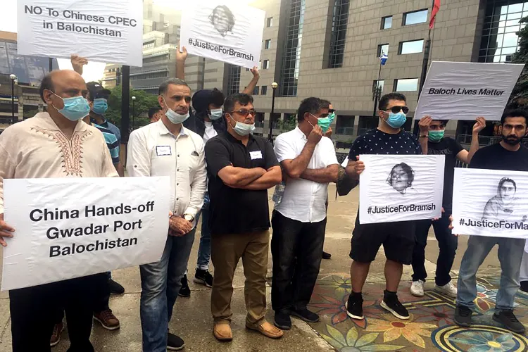  Baloch political and human rights activists hold placards in protest (file)