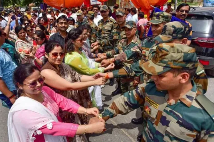 Women citizens tying Rakhi on the wrists of soldiers