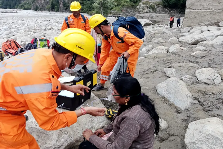 NDRF personnel provide medical aid as the conduct rescue operations and evacuate stranded and affected people after the massive cloudburst at Dharali, in Uttarkashi (file)