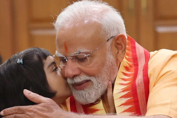 A child with Prime Minister Narendra Modi after tying Rakhi on him in Delhi