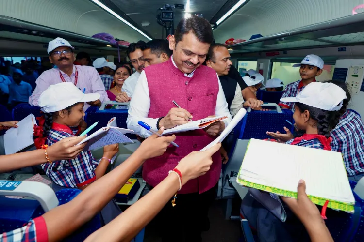 Maharashtra Chief Minister Devendra Fadnavis interacts with students during the flag-off ceremony of Nagpur to Pune Vande Bharat Express by Prime Minister Narendra Modi via video conferencing, in Nagpur.