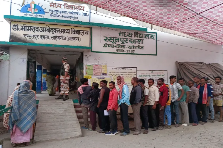 Voters wait in queues to cast their votes (file)