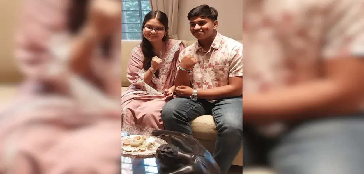 Amanta Ahmed showing her transplanted hand and Shivam Mistry showing the rakhi Amanta tied of his wrist