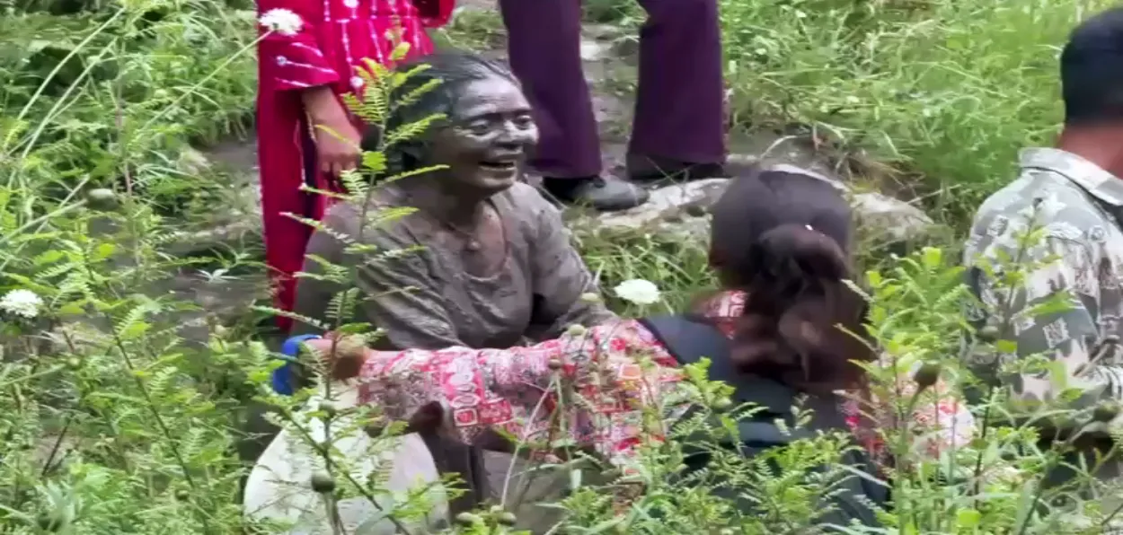A survivor of the flash floods in Kishtwar crying