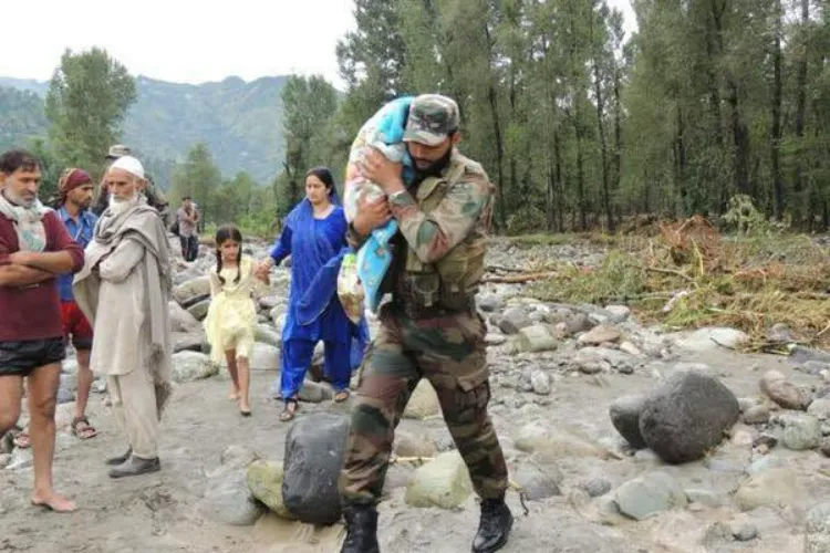 An army man carrying a child in Kishtwar