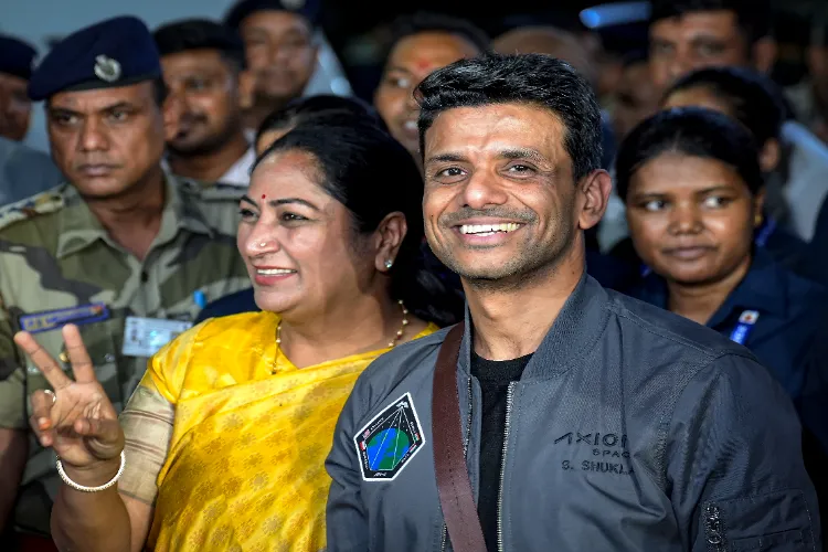 Gr. Capt Shubhanshu Shukla with Delhi Chief Minister Rekha Gupta at Delhi airport
