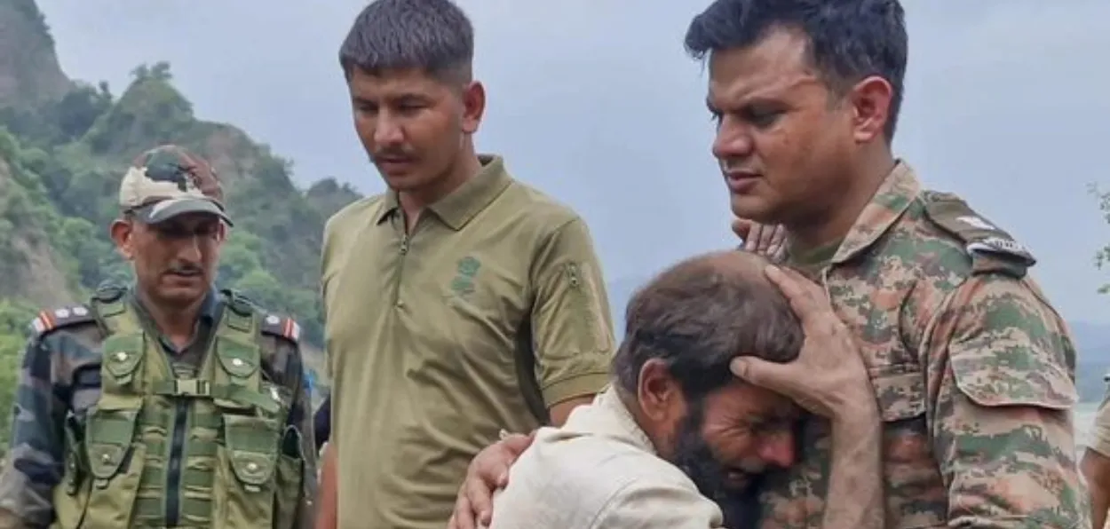 A survivour of the flash floods in Kishtwar breaks down on seeing Army personnel