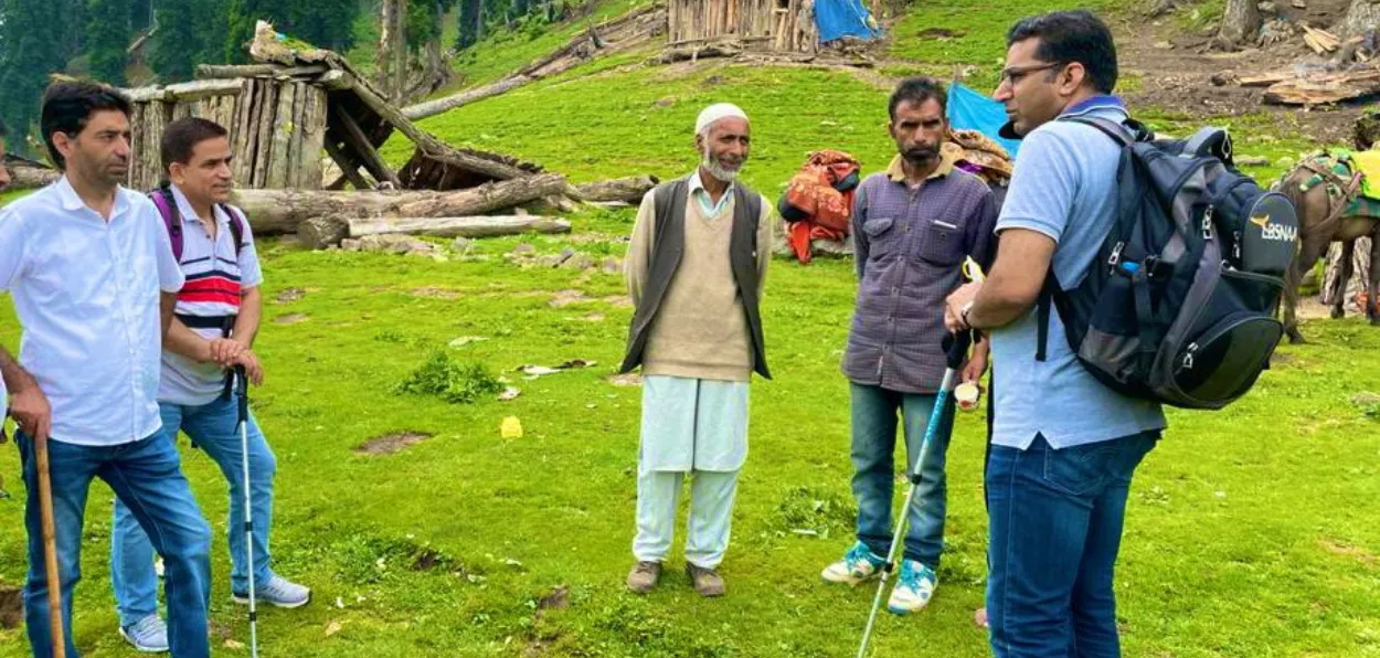 Shahid Iqbal Choudhary(Extreme right) with nomadic people in J&K during his tenure as Secretary, Tribal Affairs department of J&K
