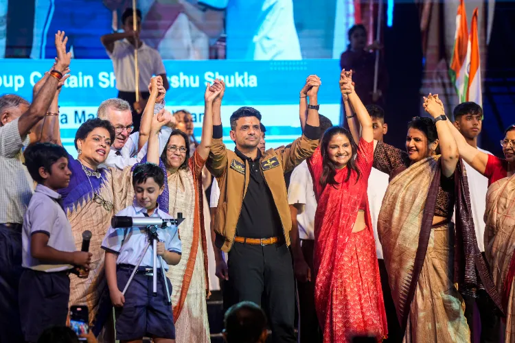 Group Captain Shubhanshu Shukla with his wife Kamna during a felicitation ceremony after his historic mission to the International Space Station (ISS), organised by his alma mater City Montessori School 