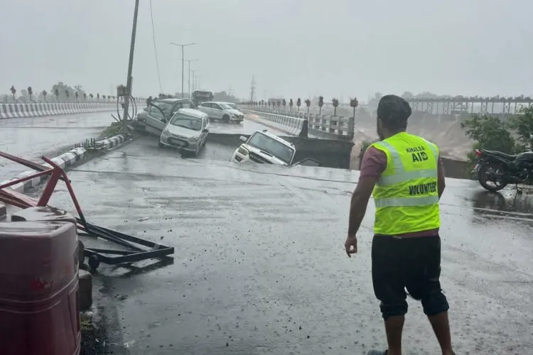 Tawi bridge showing its collapsed part under the impact of flood 