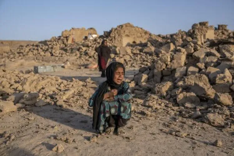 An Afghan child at the village destroyed by earthquake