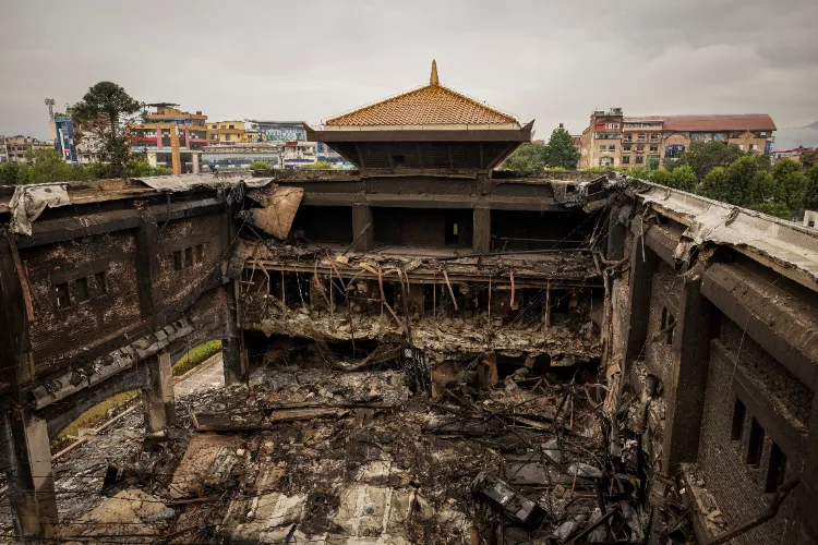 Burnt remains lie inside a section of the Parliament house, which was set on fire by the protesters in Kathmandu