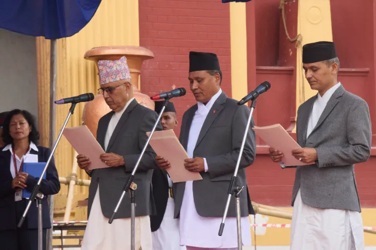 New Ministers, from left, Rameshwor Prassad Khanal, Minister of Finance, Kulman Ghising, Energy and irrigation Ministry, and Om Prakash Aryal Home Ministry attend an oath swearing ceremony