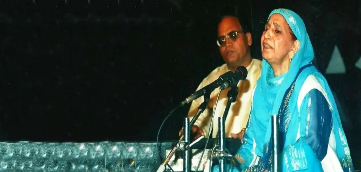 Raj Begum singing at a concert