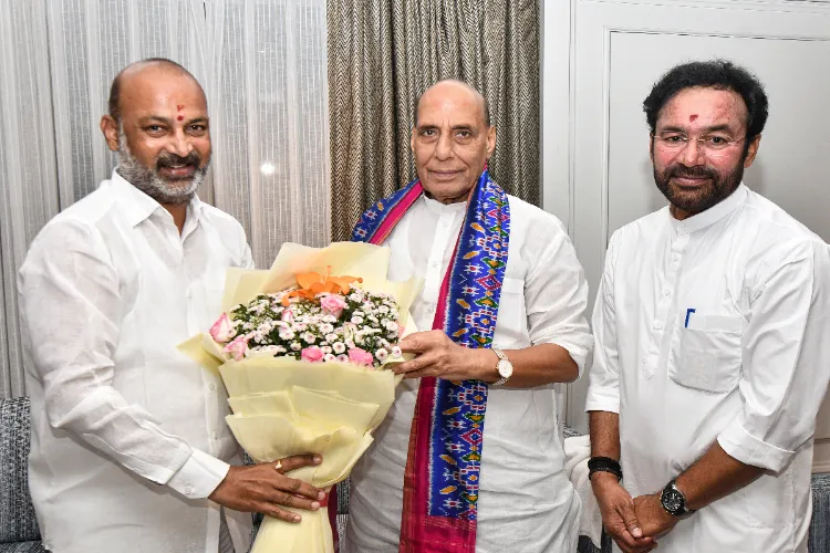 Defence Minister Rajnath Singh with Union Minister G. Kishan Reddy and Minister of State Bandi Sanjay Kumar, in Hyderabad