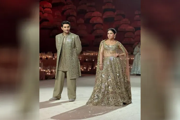 Sara and Ibrahim Ali walking down the ramp